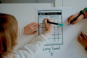 Child engaging in interactive Cambridge-style learning activity at Archers College in Roodepoort